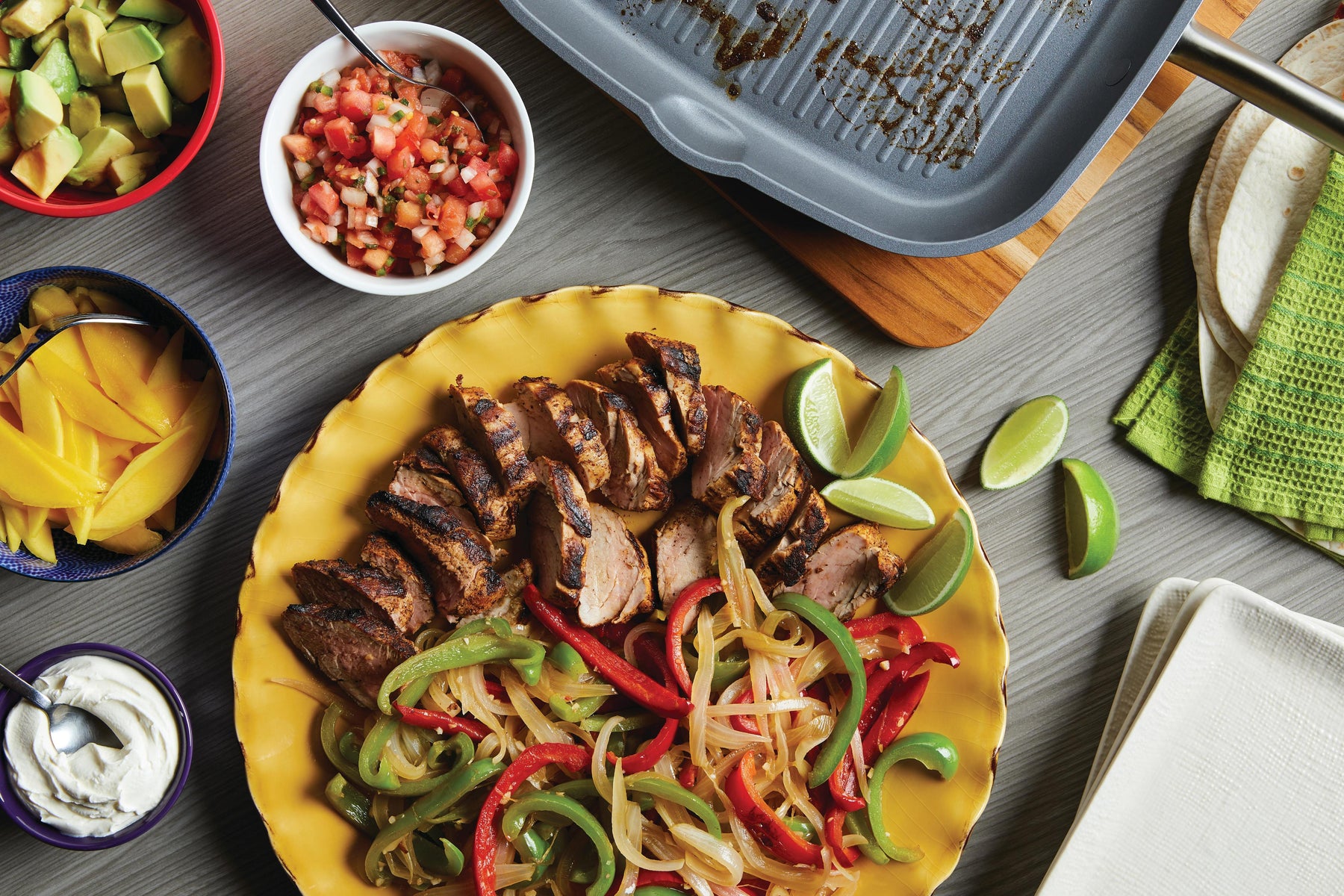 Pork Fajitas with Mango, Peppers, & Onions