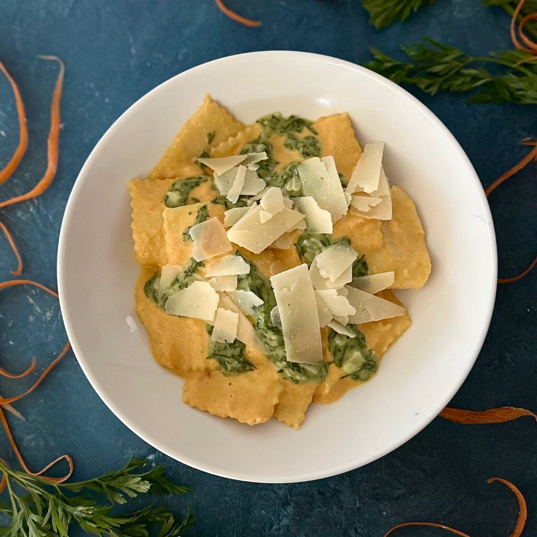 carrot ginger pasta on a white plate 