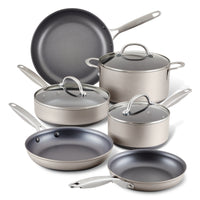 A set of six gray non-stick cookware pieces, including three frying pans, two saucepans with lids, and a stockpot with a lid, all featuring metal handles.