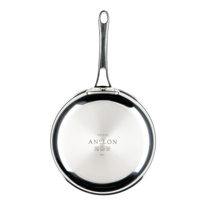 A bottom view of the polished stainless steel base of an Anolon EverLast Tri-Ply Clad frying pan, highlighting the etched Anolon logo and technical specifications in the center, with the long handle extending upward.