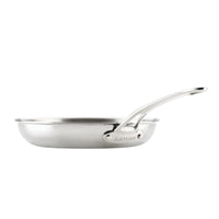 A side-profile view of an Anolon EverLast Tri-Ply Clad stainless steel frying pan with a long, curved handle, shown against a solid white background to highlight its polished finish and sleek design.