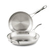 Two EverLast Tri-Ply Clad Stainless Steel Frying Pan Set pans, both with metal handles and a sleek brushed finish—one flat, one upright—make stylish, modern cookware for any kitchen.