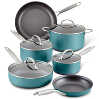 A collection of teal non-stick cookware including two frying pans, two saucepans with lids, a sauté pan with lid, and a stockpot with lid, all with metal handles, displayed against a white background.