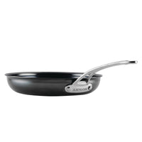 The 10-Inch N₂ Carbon Steel Frying Pan by N₂ Carbon Steel, shown in black with a shiny silver handle and a durable nonstick patina, is viewed from the side against a white background.