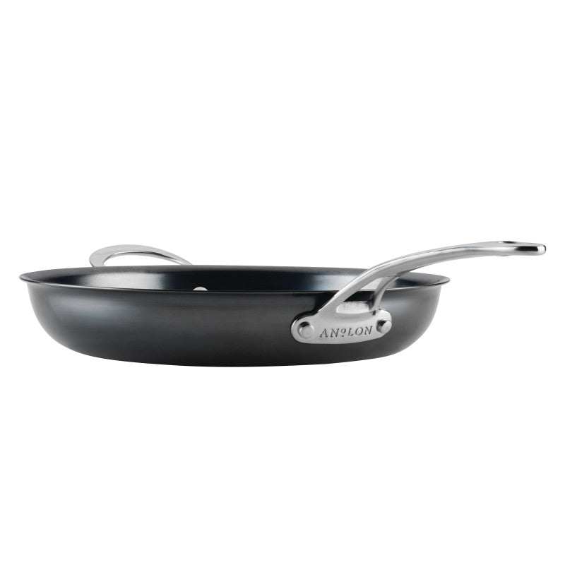 A 12-Inch N₂ Carbon Steel Frying Pan with a black finish, featuring two metal handles—one long, one short. The brand N₂ Carbon Steel is engraved at the base of the long handle. The pan is displayed against a white background.