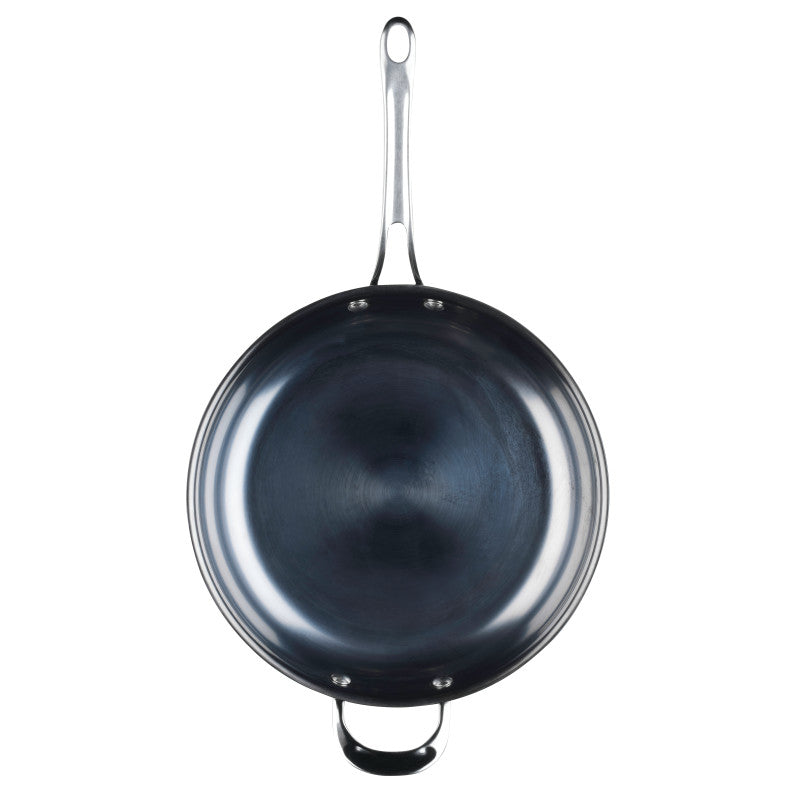 The 12-Inch N2 Carbon Steel Frying Pan by N2 Carbon Steel features a long handle and a smaller helper handle, displaying its sleek, durable finish in a top-down view against a white background.