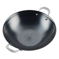 The N2 Carbon Steel Wok by N2 Carbon Steel features a shiny black finish, two stainless steel handles, and a natural nonstick patina, shown from above on a white background to highlight its sleek design.
