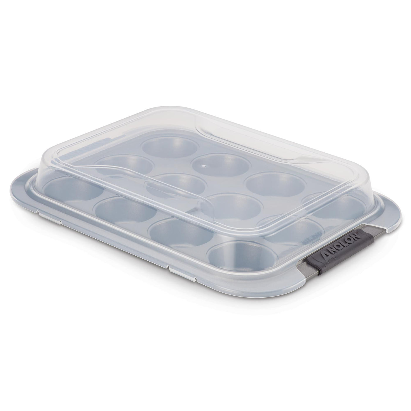 A gray muffin tin with a transparent plastic lid and black handles on each side. The tin has twelve molds arranged in a 3x4 grid, designed for baking cupcakes or muffins.