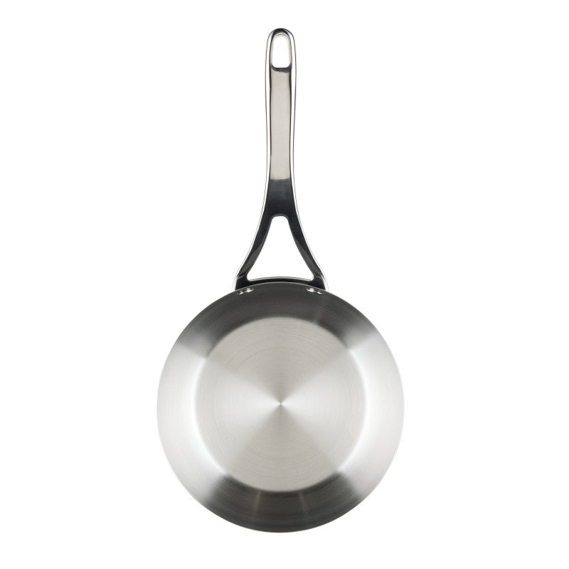 The Nouvelle Stainless 2.5-Quart Saucier with Lid is shown from above, featuring a shiny circular base and a long handle with a hanging hole. Its polished surface reflects light, highlighting its finish and excellent heat control.