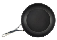 A non-stick black frying pan with a shiny silver handle, set on a plain white background.
