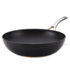 The Nouvelle Copper Luxe 12-Inch Stir Fry pan features a nonstick black surface, wide base, silver metal handle, and is induction suitable, shown on a plain white background.