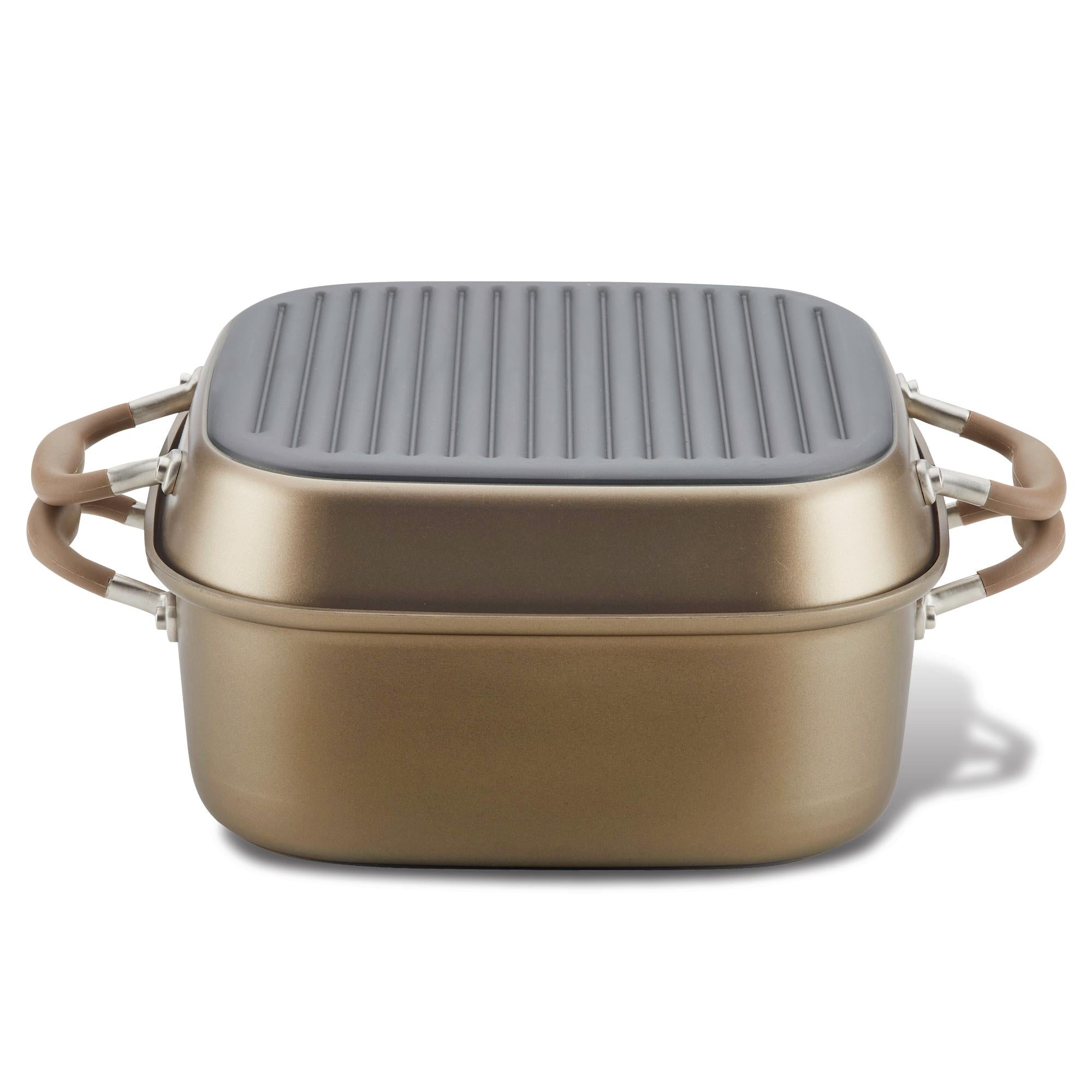 A metallic rectangular cooking pot with brown handles and a matching lid. The lid features a grooved design.