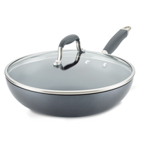 An Advanced Home 12-Inch Ultimate Stir Fry Pan, crafted from hard-anodized cookware, features a glass lid with metal rim and black handle, shown on a white background.