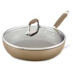 The 12-Inch Hard Anodized Nonstick Deep Frying Pan with Lid from Advanced Home showcases a sleek, modern design in brown. It includes a tempered glass lid and two handles: a rubberized grip on the side and one atop the lid. The clear glass is elegantly framed by a metal rim, enhancing the skillet's refined look.