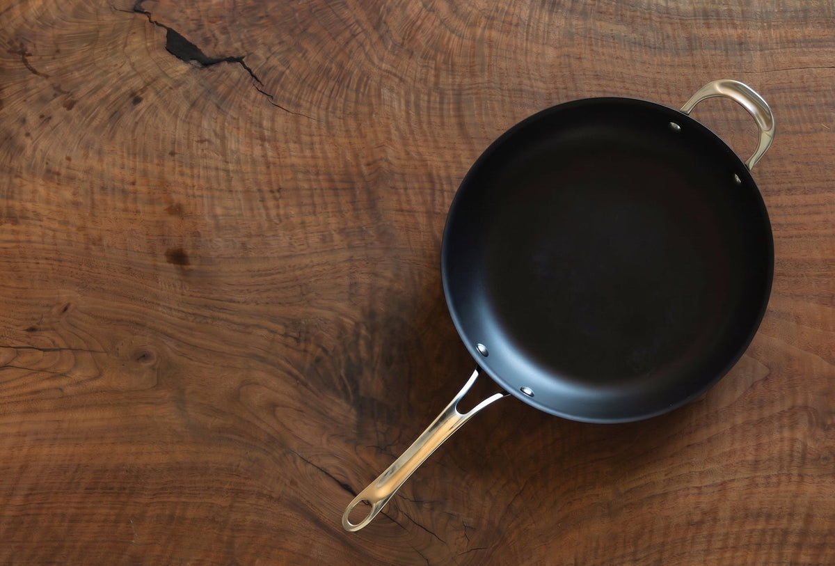 Aerial view of twelve inch carbon steel pan on wood table