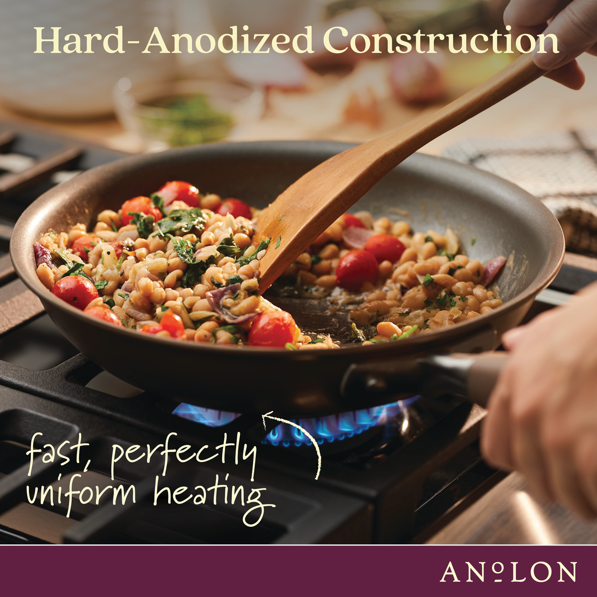 Hard-anodized construction, fast, perfectly uniform heating: bronze frying pan of white beans and tomatoes stirred over a gas flame