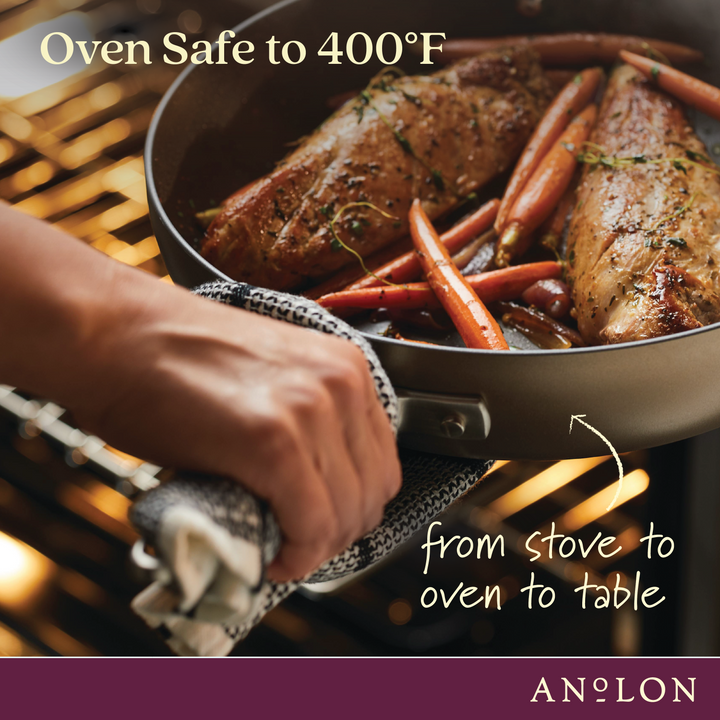 A hand with a towel holds the Round Two Step Meal Set skillet from Advanced Home, showcasing its ability to transition seamlessly from stove to oven with cooked meat and carrots. This nonstick cookware is perfect for every kitchen, being oven safe up to 400°F. The text reads 'Oven Safe to 400°F and from stove to oven to table.' Advanced Home branding is visible at the bottom.