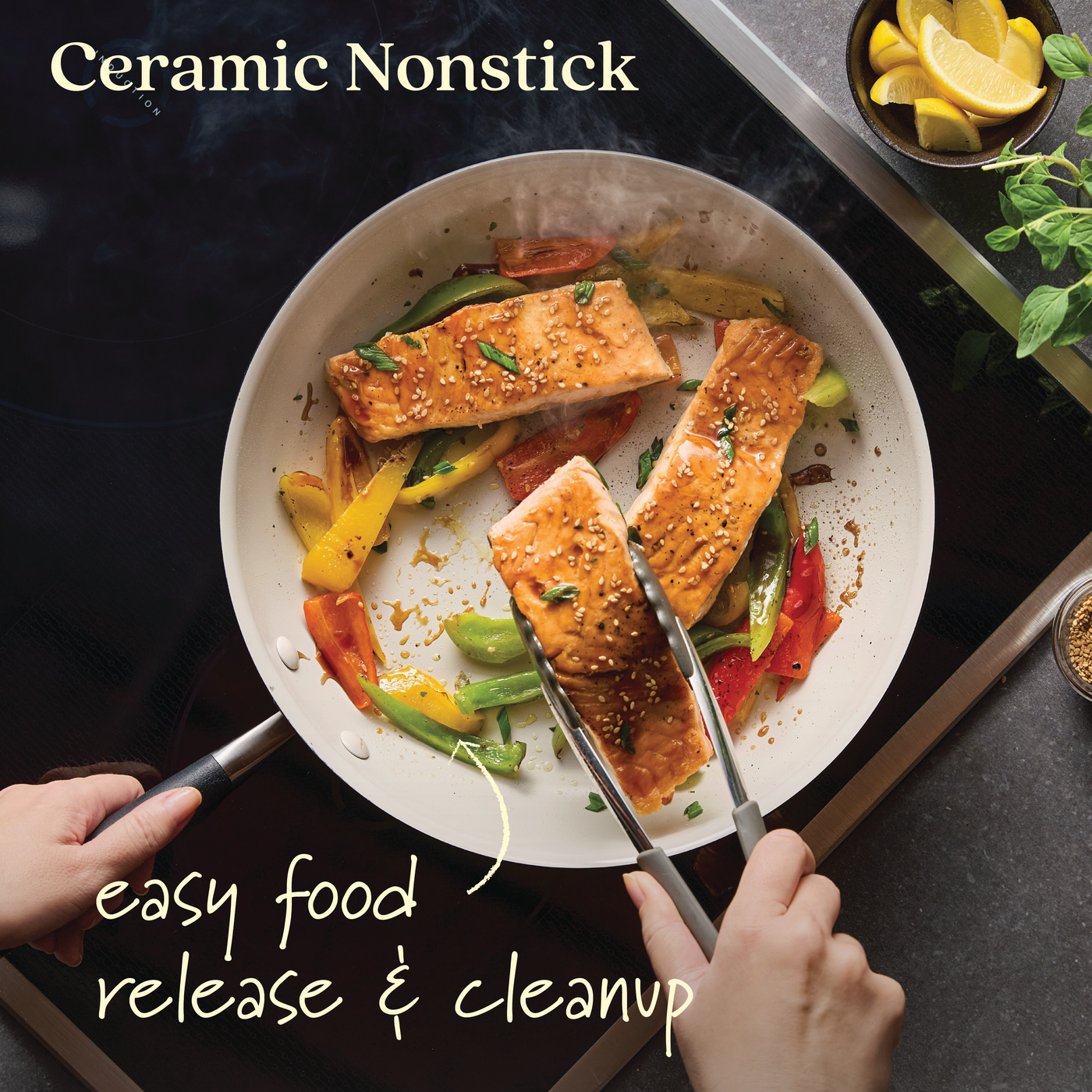 With tongs in hand, expertly cook salmon and vegetables in a 12-inch Advanced Ceramic Nonstick Frying Pan. It highlights Ceramic Nonstick technology for easy food release & cleanup. Lemon slices and herbs nearby add freshness to this cookware pioneer scene.
