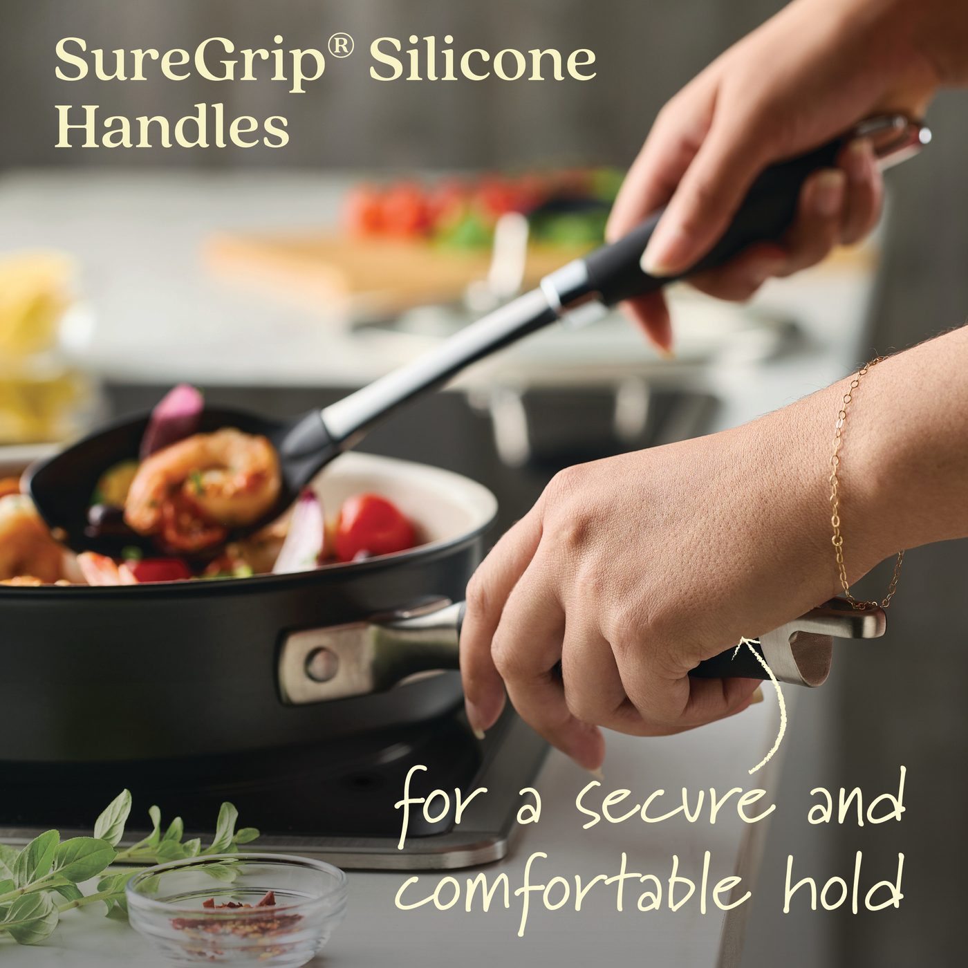 Using an Advanced Ceramic 10-Piece Nonstick Cookware pan, someone cooks while holding the black SureGrip® silicone handles, highlighted in the image for their secure and comfortable grip.