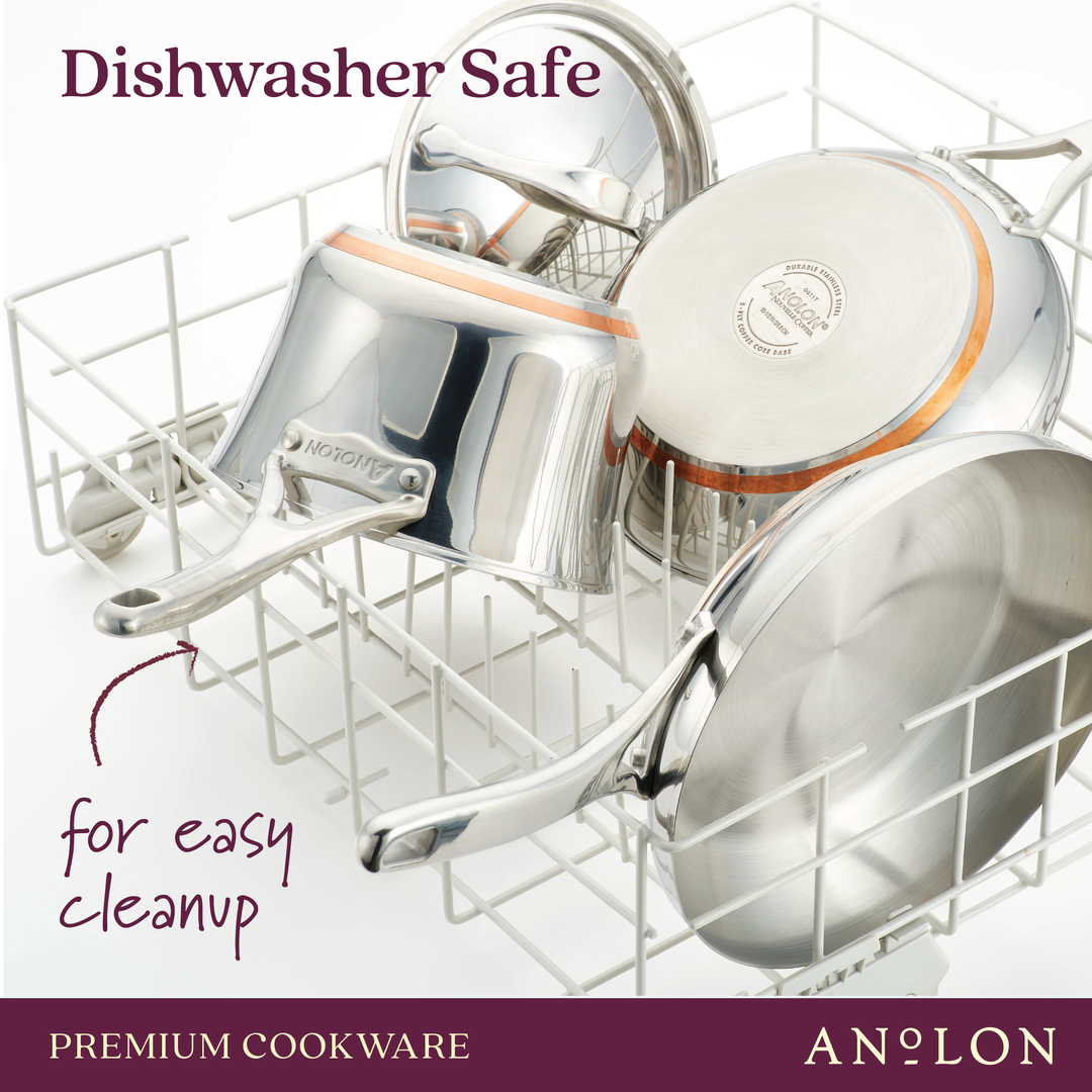 A set of Nouvelle Stainless cookware, showcasing an 8" & 9.5" frying pan set, rests in a dishwasher rack. Text reads Dishwasher Safe for easy cleanup and superior heat control. The branding Anolon, Premium Cookware appears at the bottom.