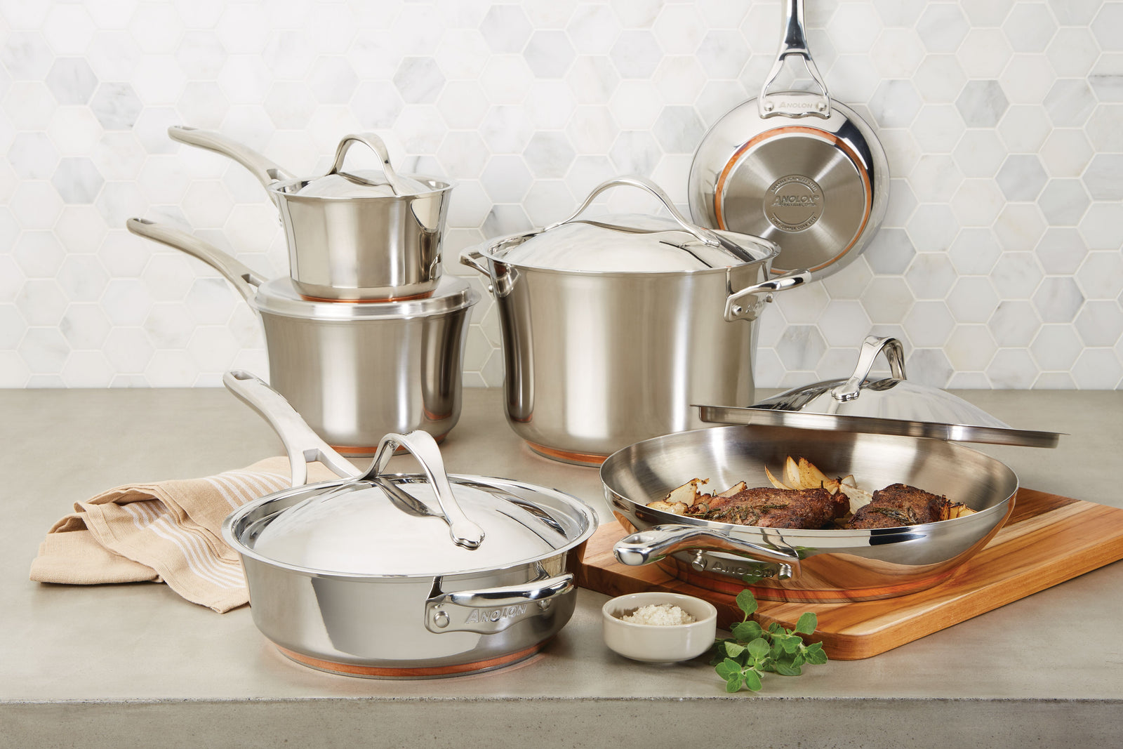 Stainless steel cookware set on counter