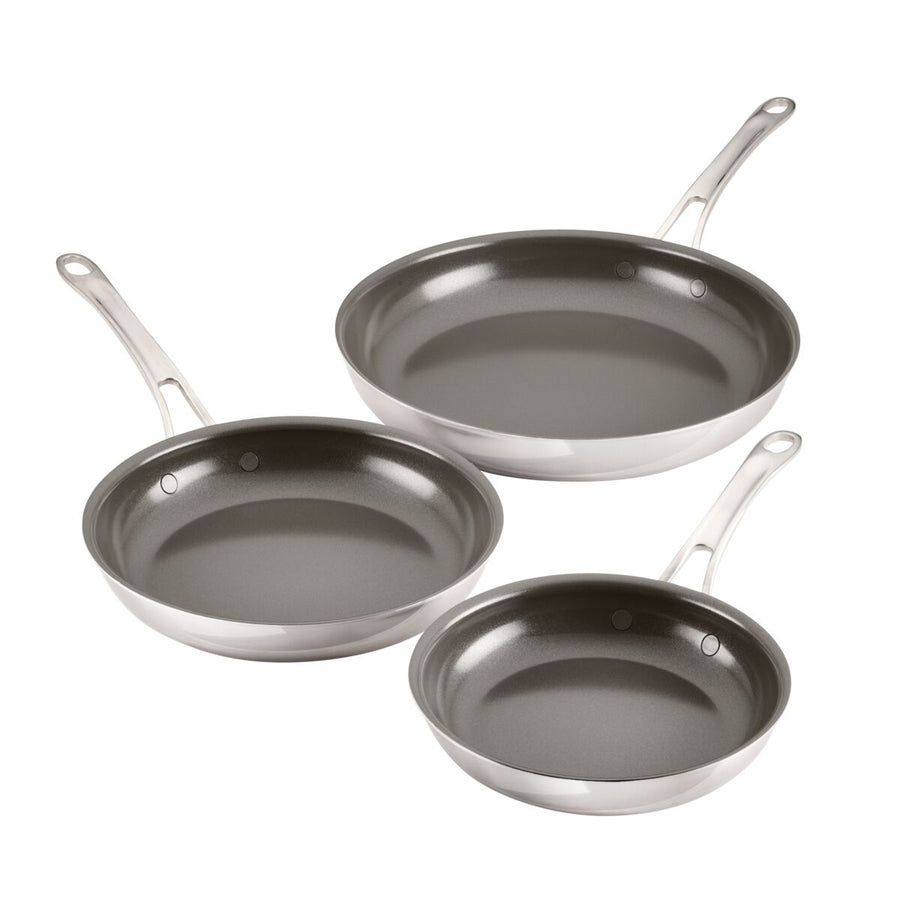 Three frying pans from the EverLast Ceramic Stainless Steel 3-Piece Ceramic Nonstick Set are displayed on a white background. Each pan, varying in size, has long handles with hanging holes, showcasing the stainless steels durability and the smooth ceramic nonstick surface youve come to expect.