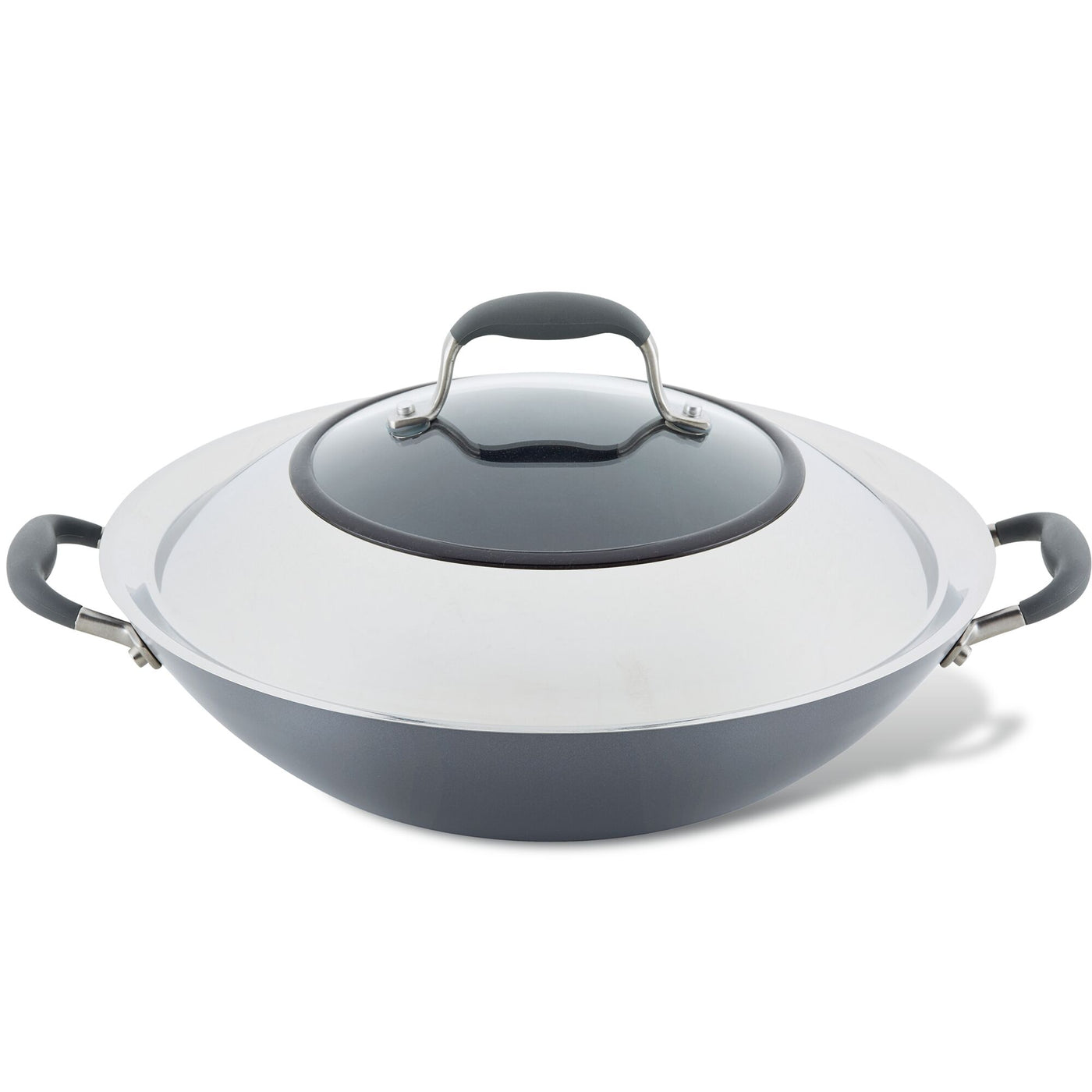 A covered wok with black handles and a lid sits on a white background. The wok has a metallic finish.