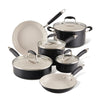 The Advanced Ceramic 10-piece cookware set features ceramic nonstick interiors and glass lids. With sturdy handles and a compact design, this elegant black set on a white background is perfect for any modern kitchen.