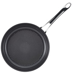 A black AnolonX 10-Inch and 12-Inch Hybrid Nonstick Frying Pan, featuring a grid-patterned surface and a long handle suitable for induction cooking, is set against a white background.