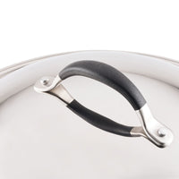 Here's a rewrite of the sentence using the provided product data:

This close-up showcases Advanced Home's 14-Inch Stainless Steel Domed Lid, featuring a sleek, black handle. The lid's durable and polished stainless steel surface reflects light brilliantly, highlighting its refined finish. The handle is secured with metal rivets and boasts a smooth, curved design for comfortable gripping.