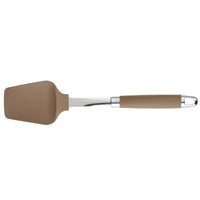 A brown silicone spatula with a stainless steel handle. The spatula has a smooth, rectangular, slightly curved head designed for flipping or stirring food. The handle has a brown silicone grip for comfortable use.