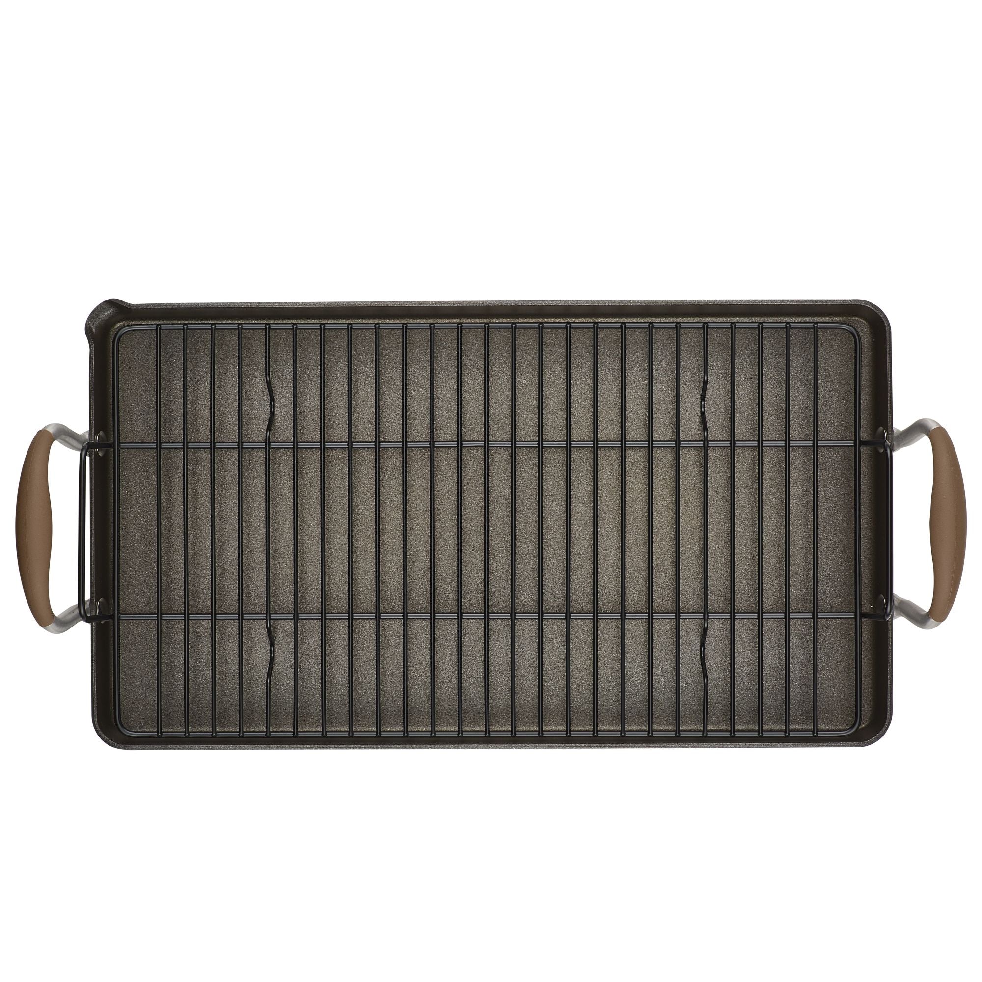 A rectangular baking pan with a wire rack resting inside. The pan has two handles on the shorter sides, each with a brown grip. The rack is metal, consisting of parallel bars running the length of the pan.