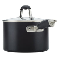 A black saucepan with a stainless steel lid and handle, featuring a small spout on the side. The handle has a black grip for easy handling. The saucepan has a modern and sleek design.