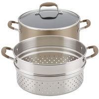 A three-tiered cookware set featuring a pot with a glass lid on top, a stainless steel steamer insert with perforations in the middle, and another similar steamer basket below. Each piece has matching handles.