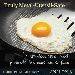 A fried egg being flipped with a metal spatula in a frying pan. Text reads: Truly Metal-Utensil-Safe, Stainless steel mesh protects the nonstick surface, and Hybrid Premium Cookware Exclusive featuring SearTech™ technology from The Everything Set: 75 Pieces.