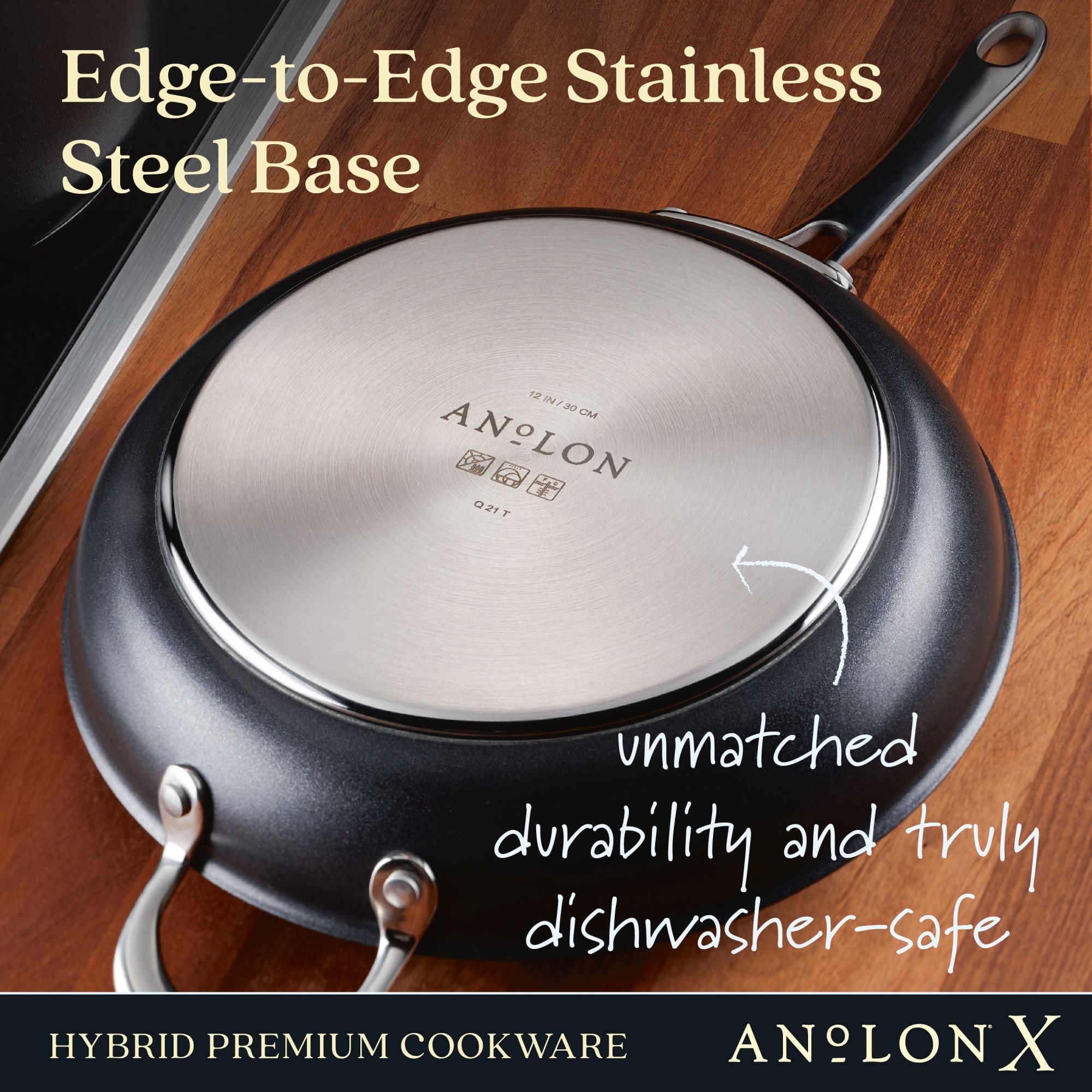 A close-up of the Anolon X 10-Inch and 12-Inch Hybrid Nonstick Frying Pan Set features its edge-to-edge stainless steel base, ideal for induction cooking. The text emphasizes durability, dishwasher safety, and the pans sleek design on a wooden surface.