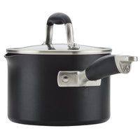 A black saucepan with a matching lid. The pot has a sleek design with a comfortable grip handle and a side spout for easy pouring. The lid has a metal handle on top.