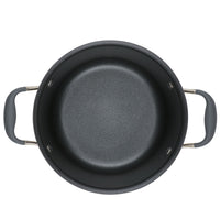 An overhead view of a black non-stick pot with two gray handles on either side. The pot has a smooth, textured interior and a simple, round shape against a white background.