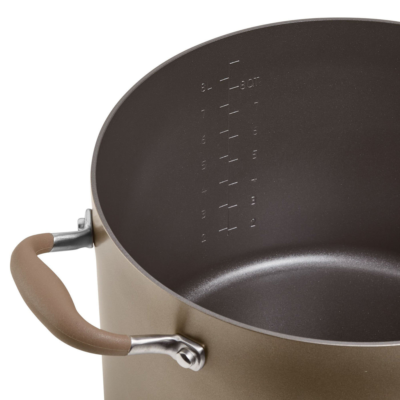 A close-up of a large, empty pot with measurement markings inside. The pot has a brown exterior and rubber-coated handles for easy grip.