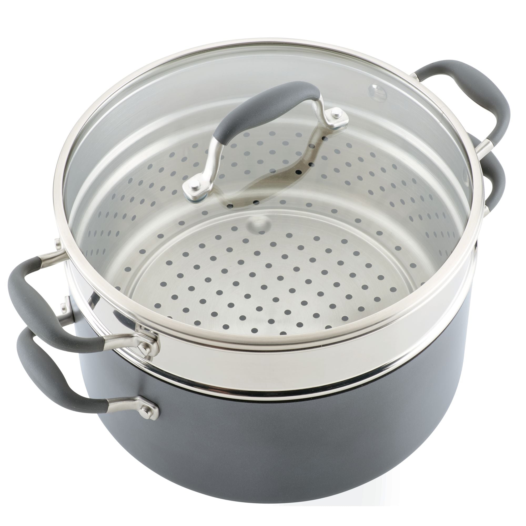 A large, gray cooking pot with a steamer insert and a transparent glass lid. The pot has black handles on the sides and lid, and the insert has multiple holes for steam to pass through.