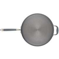 A top-down view of a non-stick pan with a long handle on the left and a shorter helper handle on the right. The pan surface is smooth and gray, with the brand name AMAZON embossed in the center.
