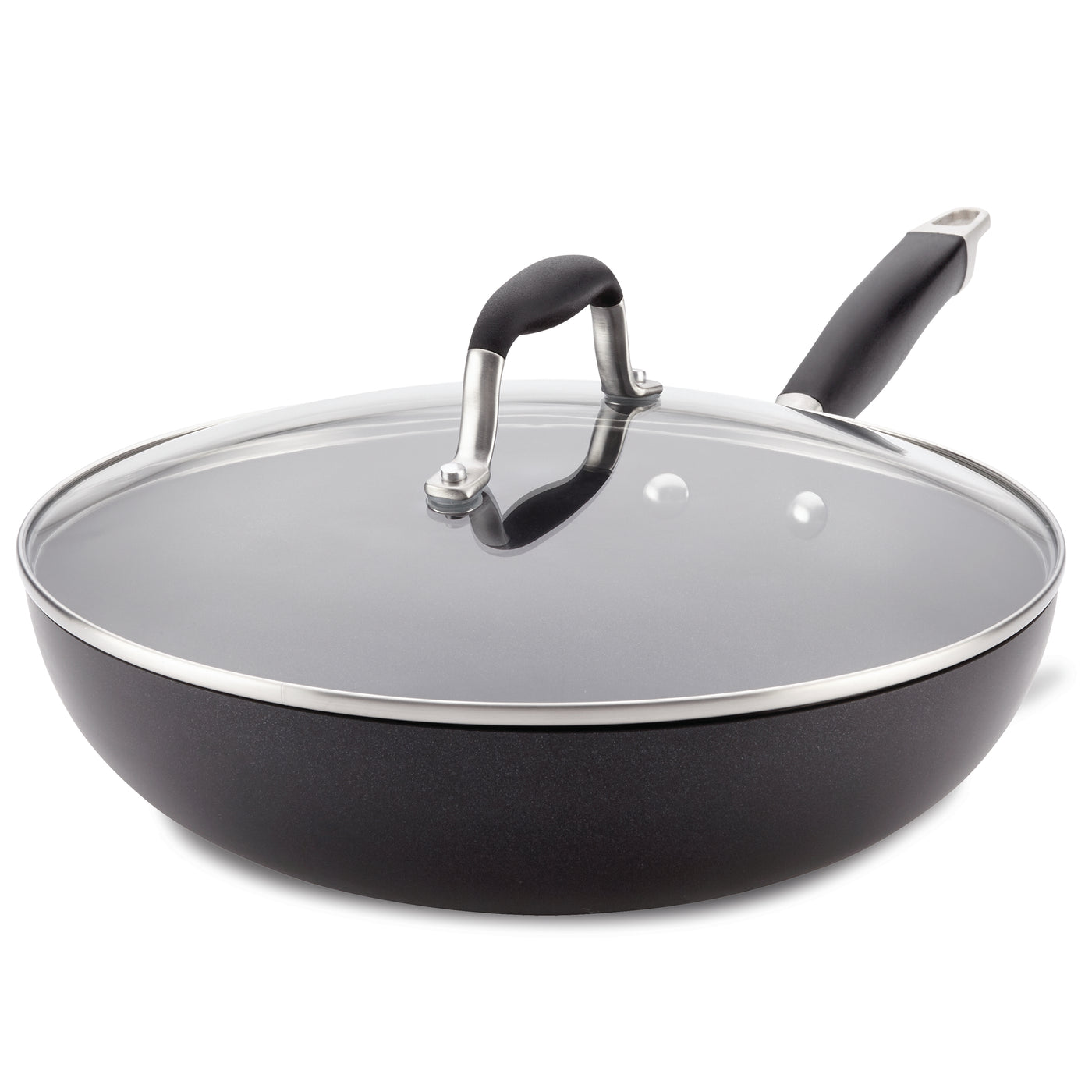 A large black nonstick frying pan with a shiny glass lid and a sleek black handle. The lid has a metal rim and a small black handle in the center. The pans design combines functionality with a modern aesthetic.