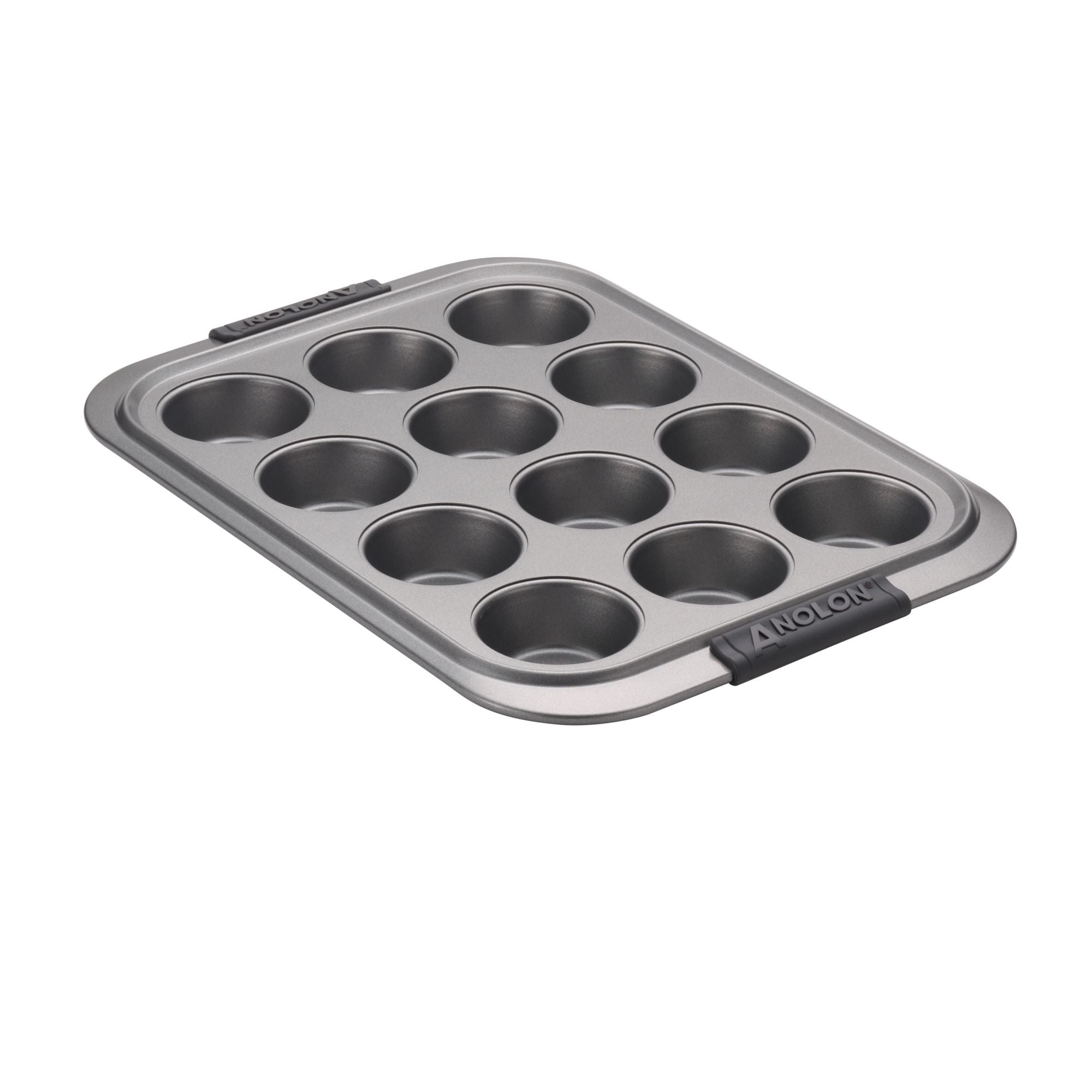 A non-stick, 12-cup muffin pan with a gray metallic finish and black handles on both ends, shown on a white background.