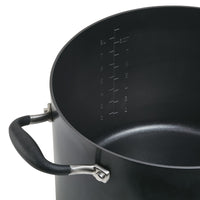 A black pot with a non-stick surface and a measuring scale inside, showing up to 8 quarts or liters. It has two sturdy handles on opposite sides.