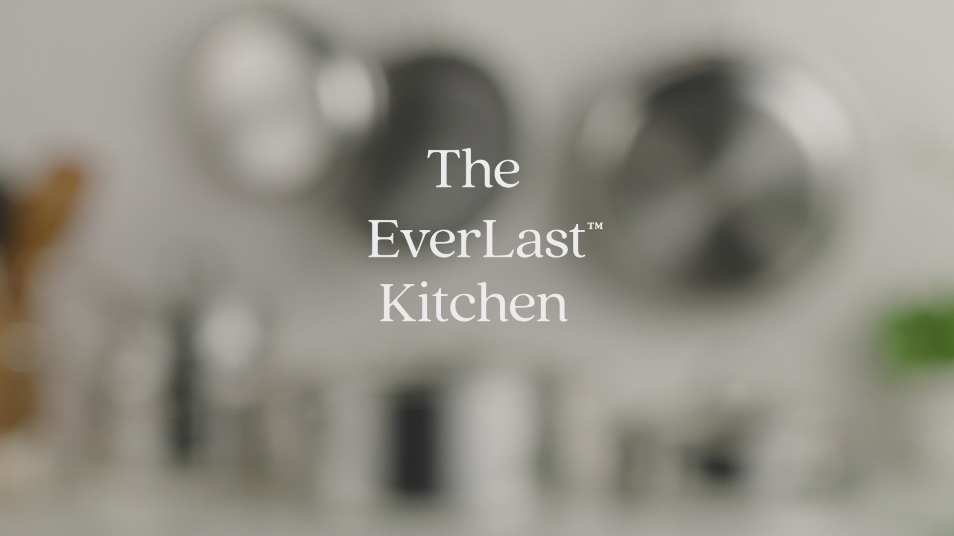 A 30-second video titled "The EverLast Kitchen." The video features a montage of the Anolon EverLast family, including Clad Stainless Steel, Clad Ceramic, and Carbon Steel cookware. It showcases various cooking techniques like searing, deglazing, and simmering, highlighting the durability, professional performance, and cohesive design of the entire collection in a modern kitchen setting.