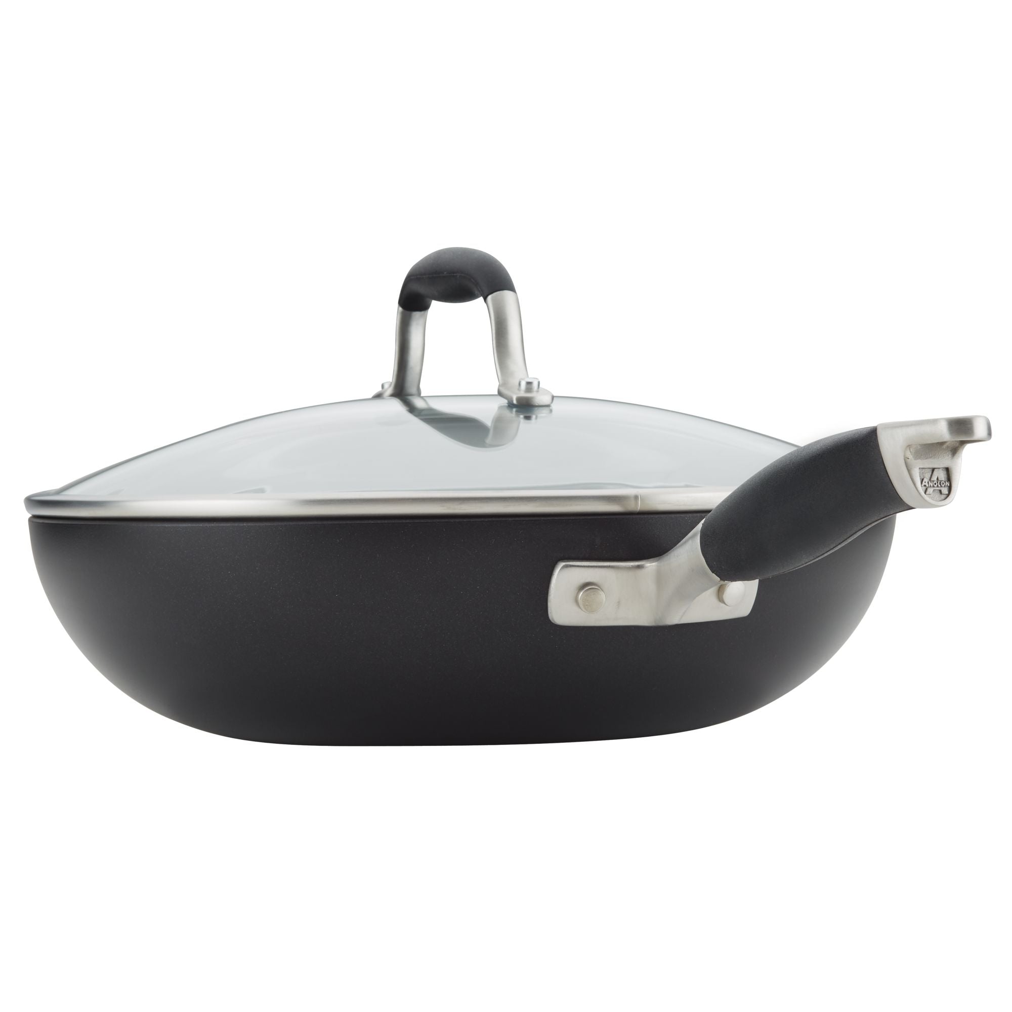 A black nonstick skillet with a glass lid and a sturdy black handle, positioned on a white background. The lid has a stainless steel rim and a matching black and silver handle.