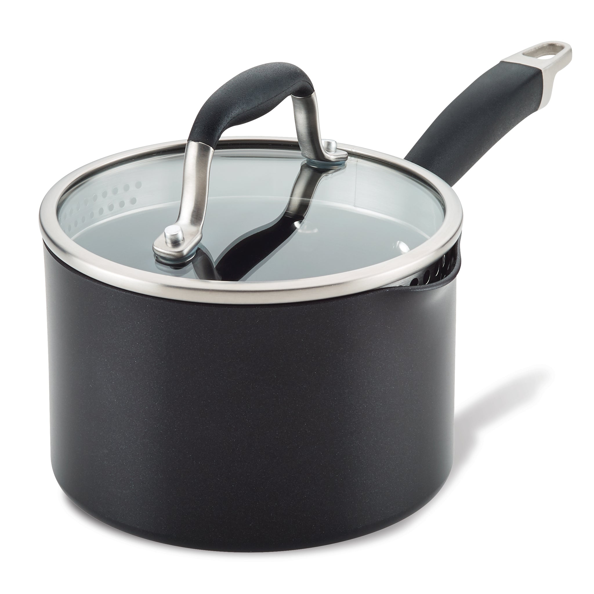 A black saucepan with a glass lid and a black handle. The lid has a metal rim and a steam vent. The handle is long and ergonomically designed. The pan sits on a white background.