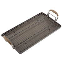 A rectangular baking tray with a fitted cooling rack and brown handles at each end.