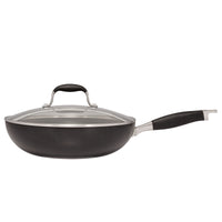 A black non-stick frying pan with a glass lid and a black handle, viewed from the side against a white background. The pan has a sleek design and appears to be in new condition.