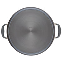 Top view of a large, circular metal cooking pot lid with two black handles on opposite sides. The surface has a brushed finish and faint text in the center.